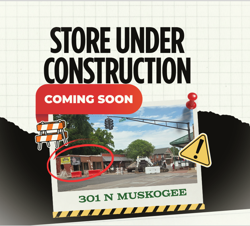 Sign indicating a store under construction at 301 N Muskogee, coming soon.